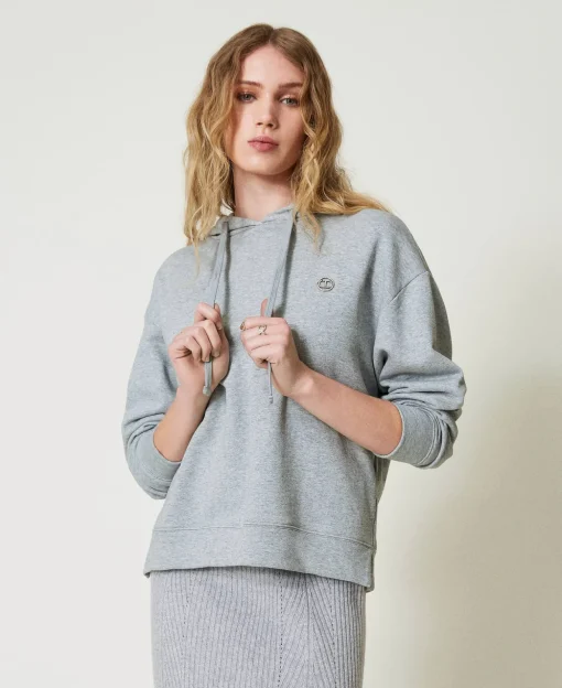 Felpa Over Con Charm Oval T