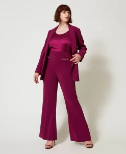 Pantaloni Flare Con Catena Oval T