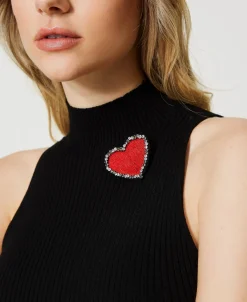 Top In Maglia A Righe Con Spilla